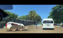 Drive pass construction workers in Jamaica