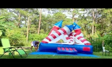 Deflate and roll up the USA flag castle bounce house