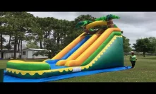 Deliver the pink and white castle bounce house and 18 feet tall palm tree water slide