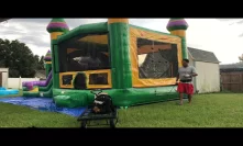 Roll up the combo bounce house with a winch