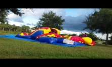 Deflate and roll up the bounce house water slide combo