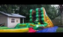 Roll up the 19 feet tall water slide in the rain