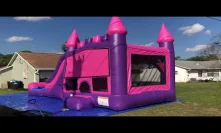 Pink waterslide bounce house combo