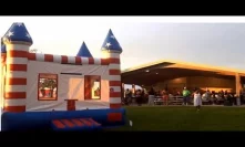USA flag bounce house at a Jamaican party
